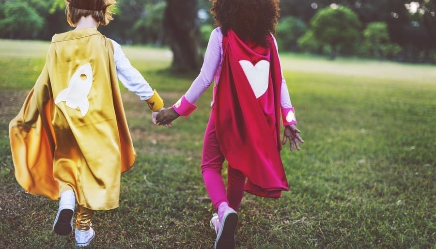 Best Friends CHildren Wearing Superhero Capes